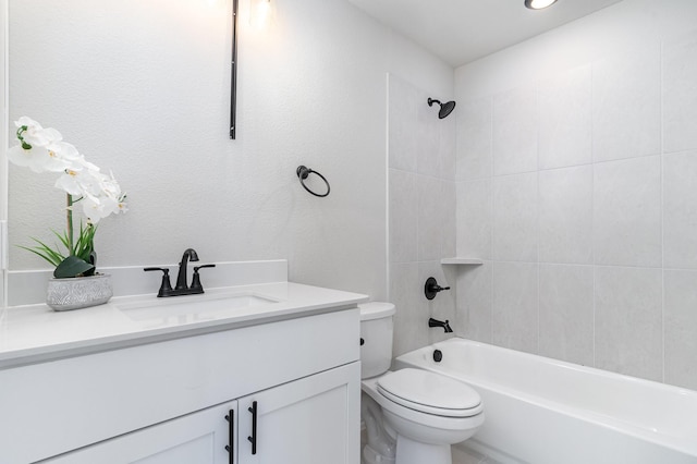 full bathroom featuring vanity, toilet, and tiled shower / bath combo