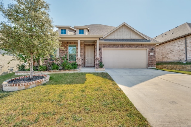 craftsman inspired home featuring a front yard and a garage