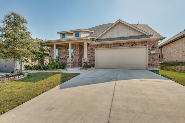 craftsman house featuring a front yard and a garage