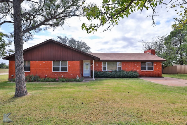 ranch-style house with a front lawn