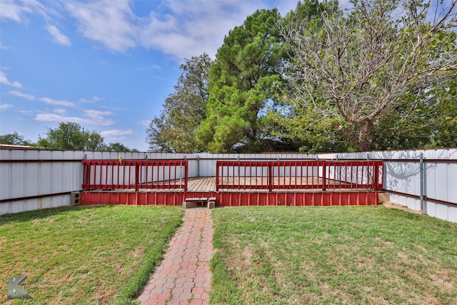 view of yard with a wooden deck