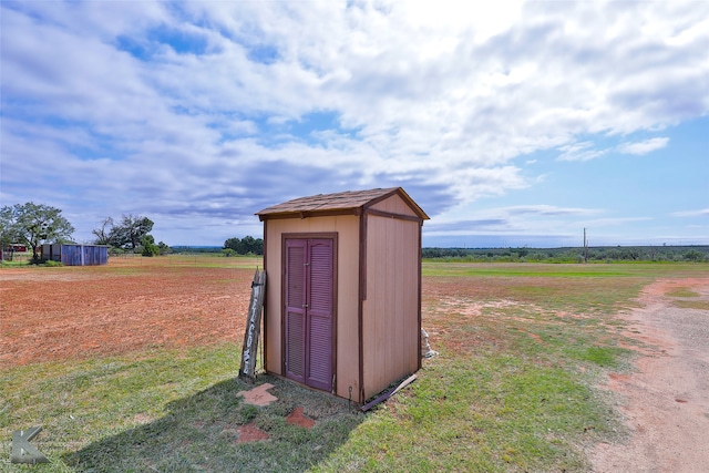 view of outbuilding featuring a rural view