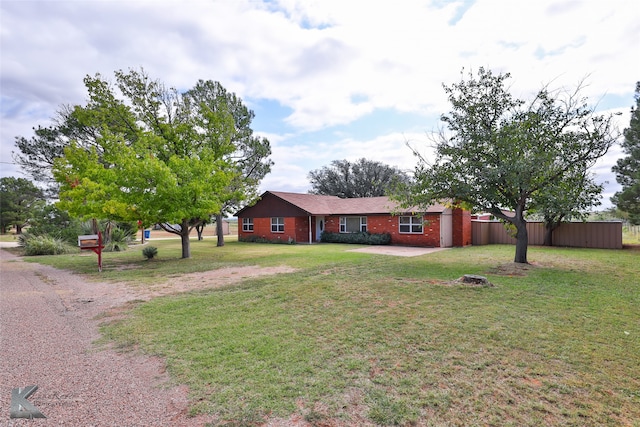 single story home with a front yard