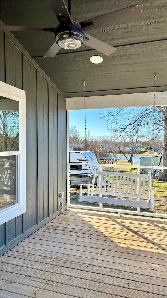 wooden deck with ceiling fan