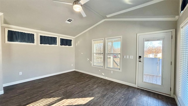 spare room with ceiling fan, dark hardwood / wood-style flooring, vaulted ceiling, and ornamental molding