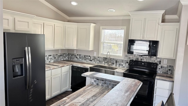 kitchen featuring crown molding, sink, white cabinets, and black appliances