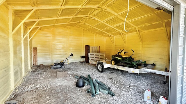 miscellaneous room with lofted ceiling