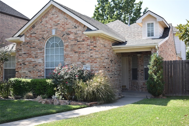 view of front of house with a front lawn