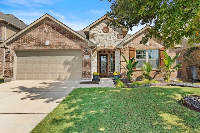 view of front of property with a front yard and a garage