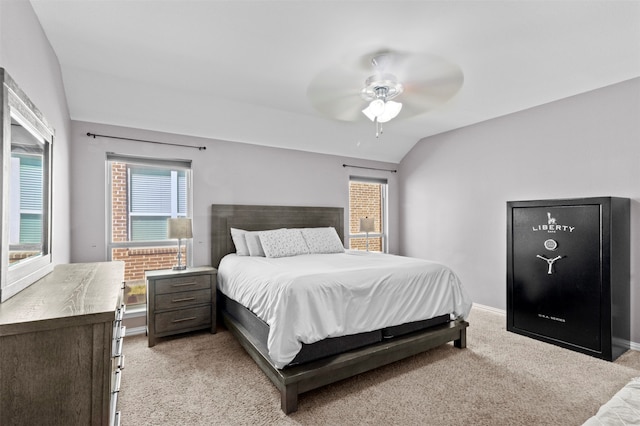 bedroom with lofted ceiling, light colored carpet, and ceiling fan