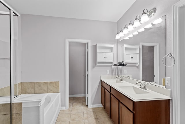 bathroom with vanity, tile patterned floors, and a washtub