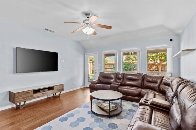 living room featuring ceiling fan, vaulted ceiling, plenty of natural light, and hardwood / wood-style floors