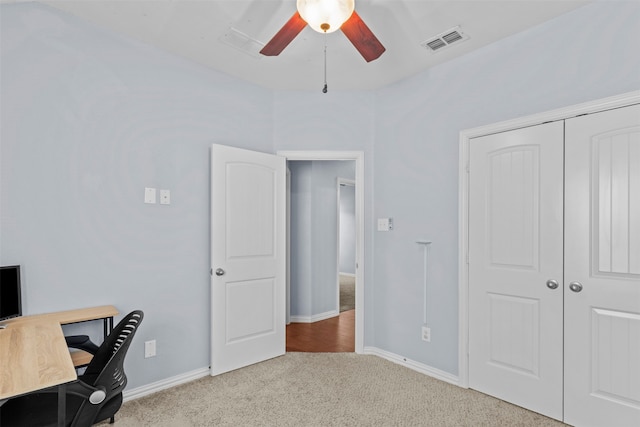 unfurnished office with light colored carpet and ceiling fan