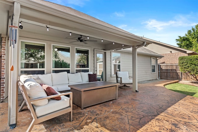 view of patio with an outdoor living space and ceiling fan