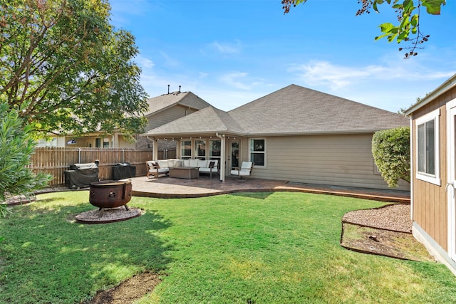 back of property with a patio area, a lawn, and outdoor lounge area