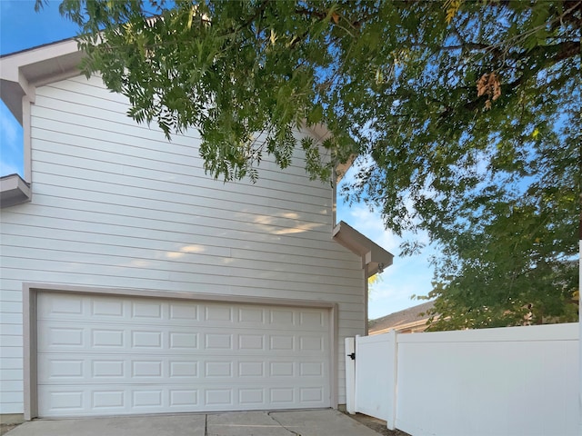 garage featuring wood walls