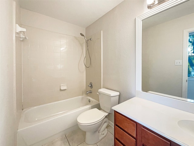 full bathroom featuring vanity, tiled shower / bath combo, toilet, and tile patterned flooring