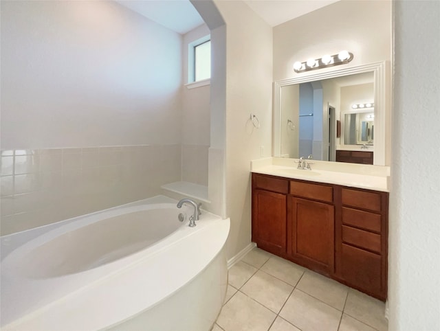 bathroom featuring vanity, a bathtub, and tile patterned flooring