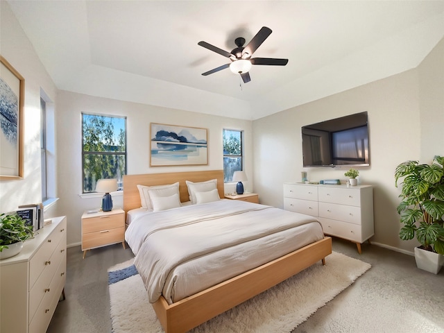 bedroom with multiple windows and ceiling fan