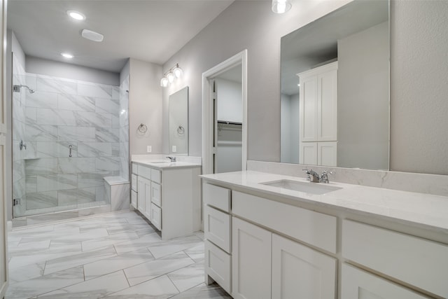 bathroom featuring vanity and tiled shower