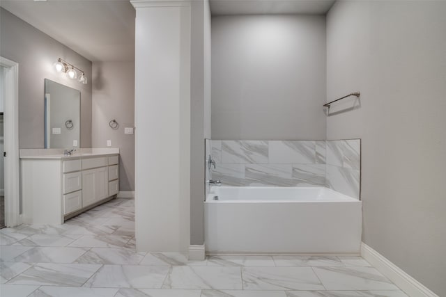 bathroom with vanity and a tub