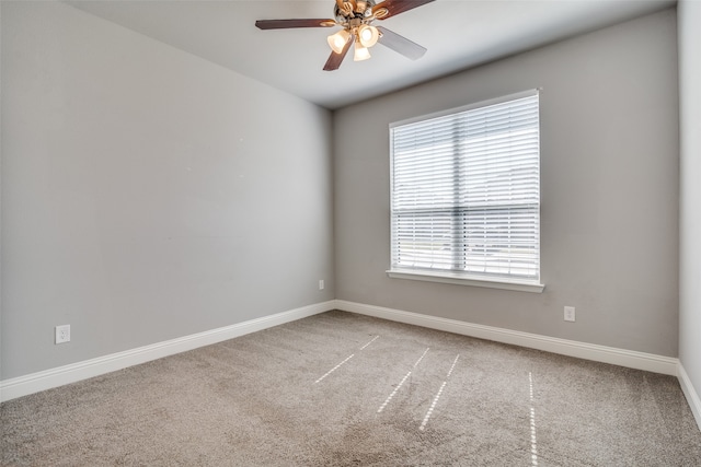 unfurnished room featuring carpet and ceiling fan