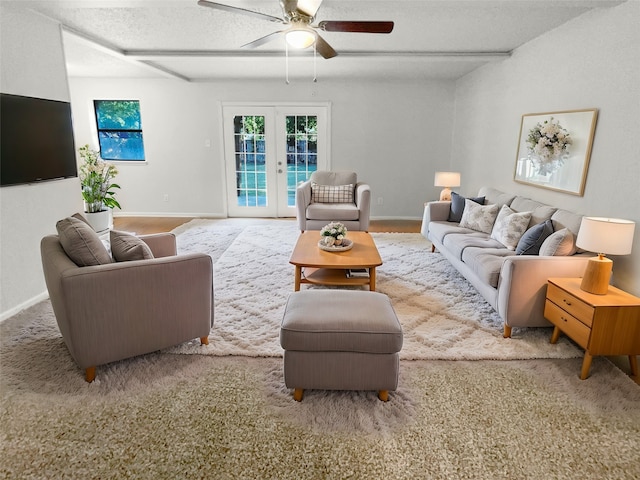 living room featuring french doors, a textured ceiling, and ceiling fan