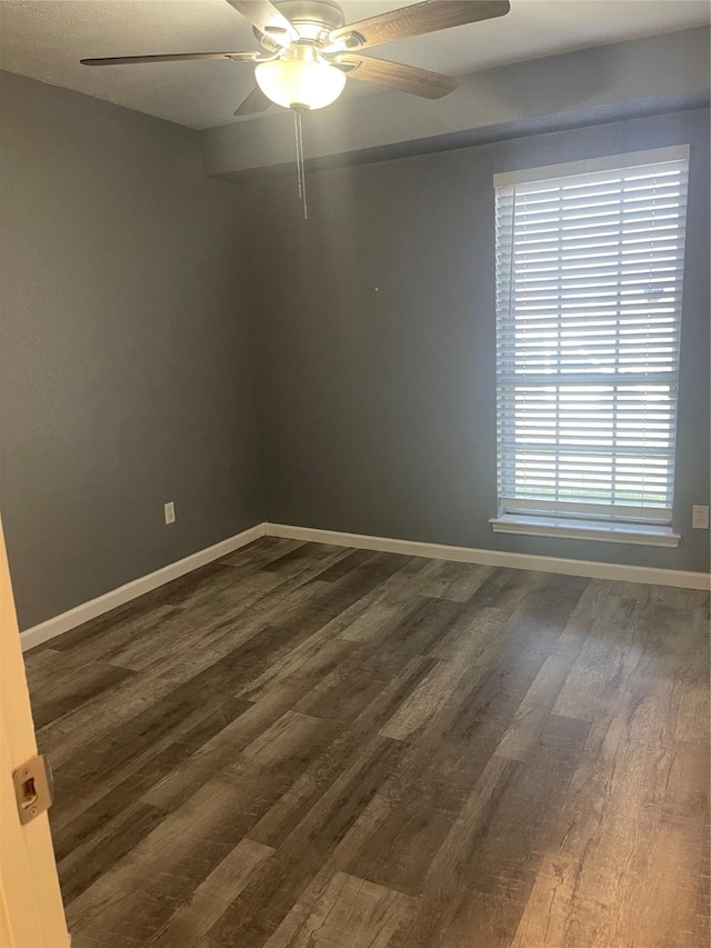 1326 Greenbriar Ln, Lancaster, TX 75146 - spare room featuring dark wood finished floors, a ceiling fan, and baseboards