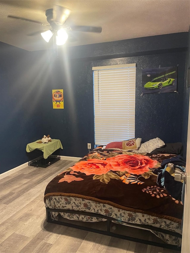 1326 Greenbriar Ln, Lancaster, TX 75146 - bedroom with wood finished floors, ceiling fan, and baseboards