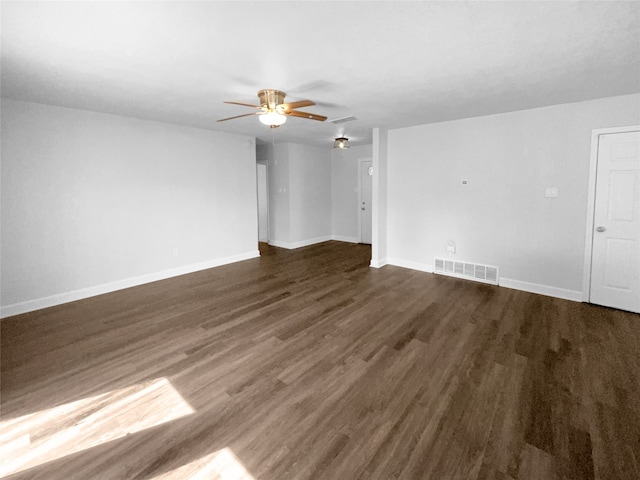 empty room with dark hardwood / wood-style floors and ceiling fan