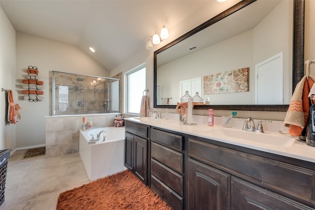 bathroom with vanity, lofted ceiling, and independent shower and bath