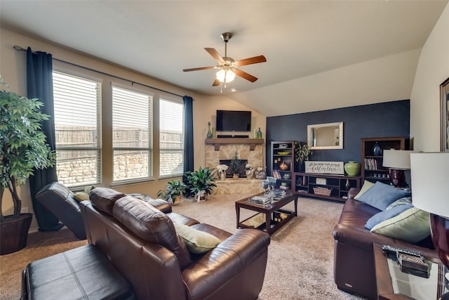 carpeted living room with lofted ceiling, a fireplace, and ceiling fan