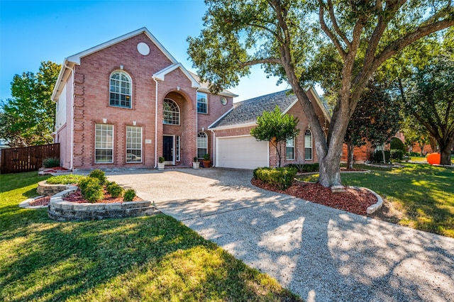 view of front of home with a front lawn and a garage