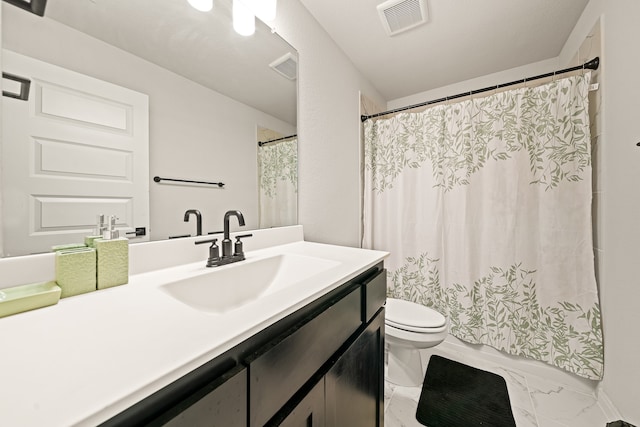 bathroom featuring vanity, toilet, and curtained shower