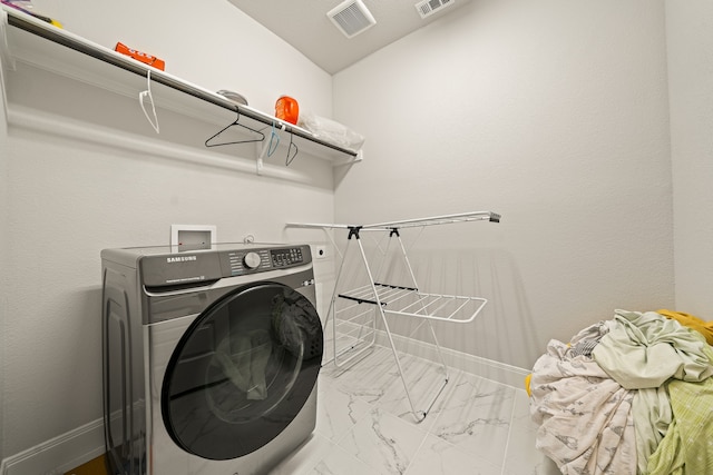 laundry area with washer / clothes dryer