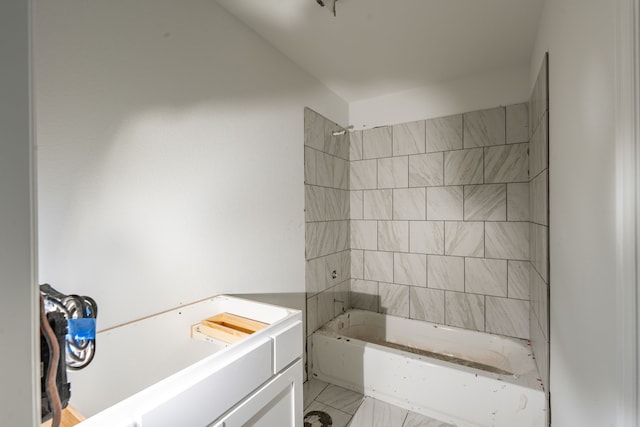 bathroom featuring vanity and tiled shower / bath combo