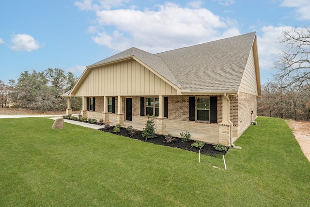 craftsman-style home with a front yard and a porch