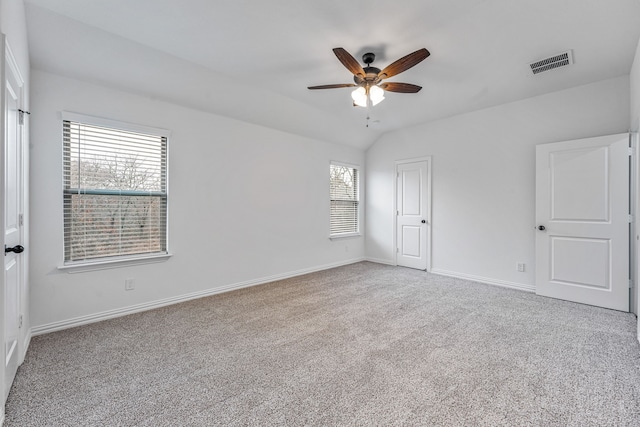 unfurnished bedroom featuring vaulted ceiling, carpet, and ceiling fan