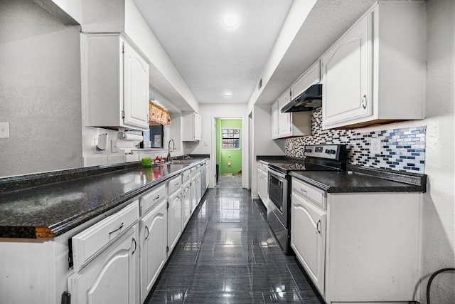 kitchen with stainless steel electric range, extractor fan, white cabinetry, dark tile patterned floors, and sink