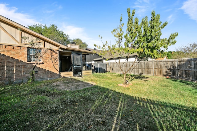 view of yard featuring a sunroom