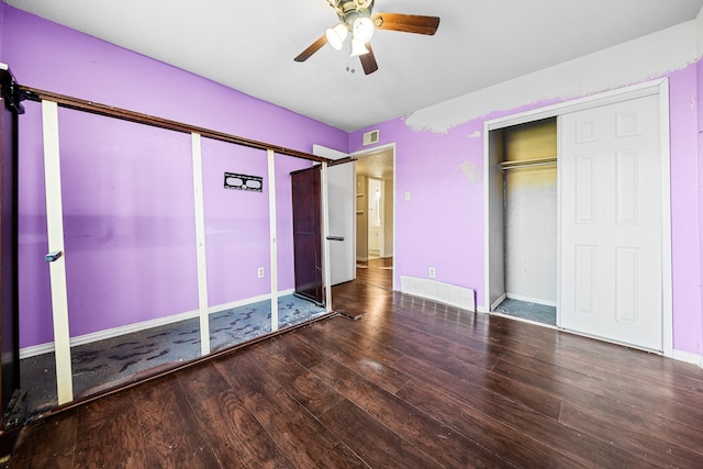 unfurnished bedroom with a closet, hardwood / wood-style flooring, and ceiling fan