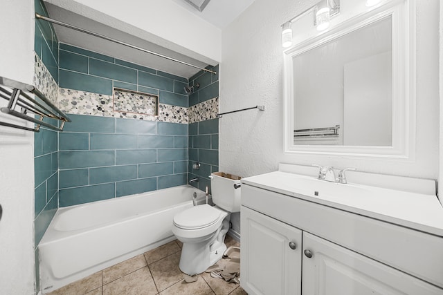 full bathroom with tiled shower / bath, vanity, toilet, and tile patterned floors