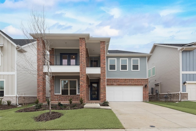 view of front of property with a garage, a front yard, and a balcony