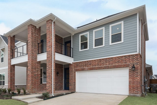 view of front of home featuring a garage and a balcony