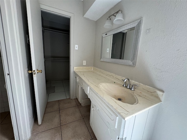 bathroom featuring vanity and tile patterned flooring