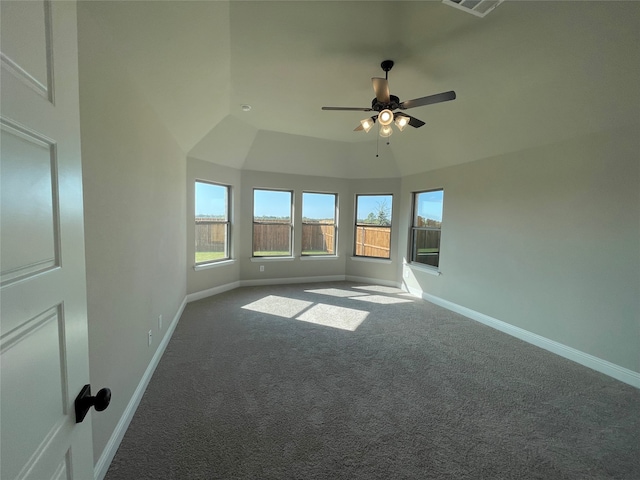 carpeted empty room featuring ceiling fan and vaulted ceiling