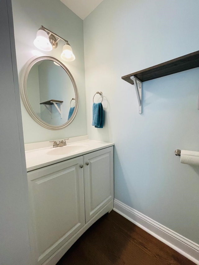 bathroom featuring vanity and hardwood / wood-style flooring