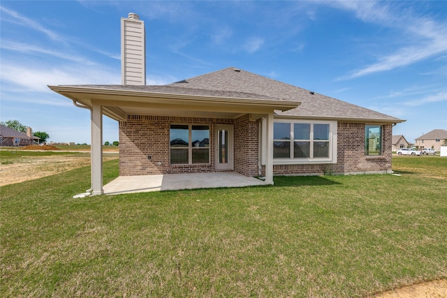 2420 Cross Timbers Dr, Lowry Crossing, TX 75069 - back of house featuring brick siding, a patio area, a yard, and a chimney