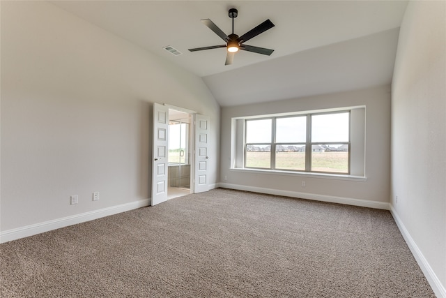 unfurnished bedroom featuring carpet, vaulted ceiling, and ceiling fan