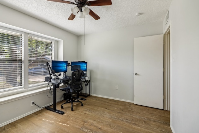 office space featuring ceiling fan, a textured ceiling, and hardwood / wood-style floors